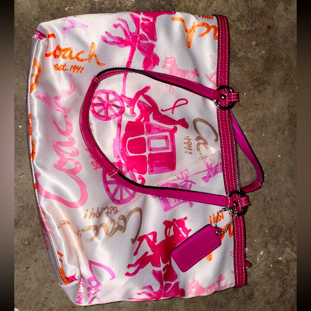 Coach purse. Pink, orange, and tan with tan interior. Used, like new.